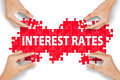 interest-rates-puzzle-hands-making-word-isolated-white-58934748